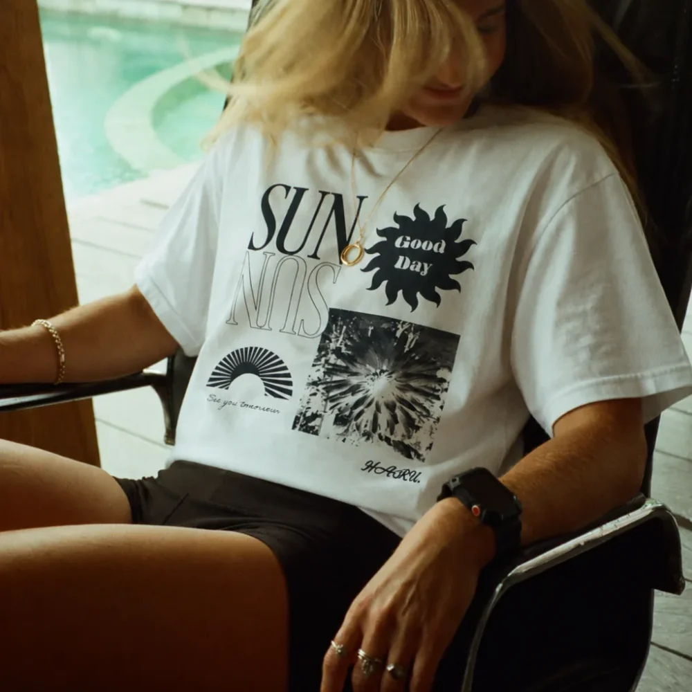 HARU oversized white graphic T-shirt with sun illustration and abstract print